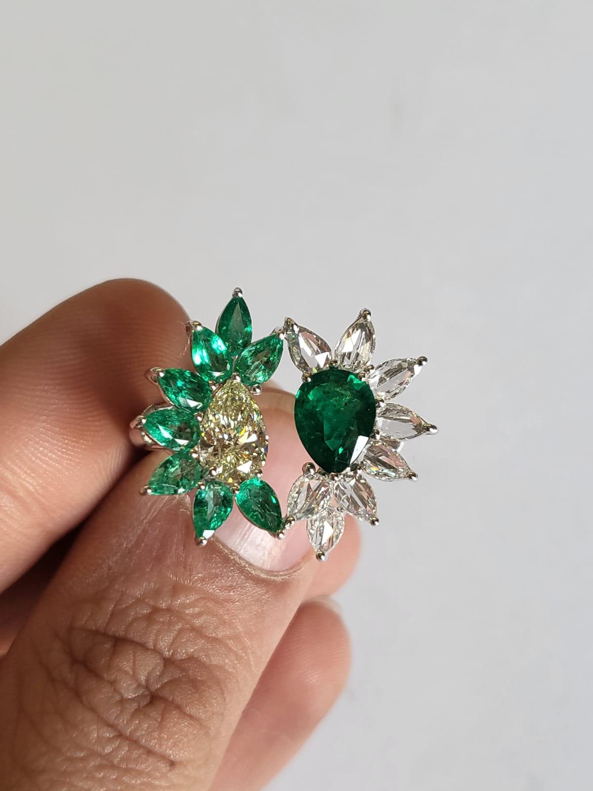 A very gorgeous and one of  kind, Emerald Engagement Ring set in 18K White Gold & Diamonds. The weight of the centre pear shaped Emerald is 1.65 carats. The weight of the other Emerald is 1.27 carats.  Both the Emeralds are completely natural,