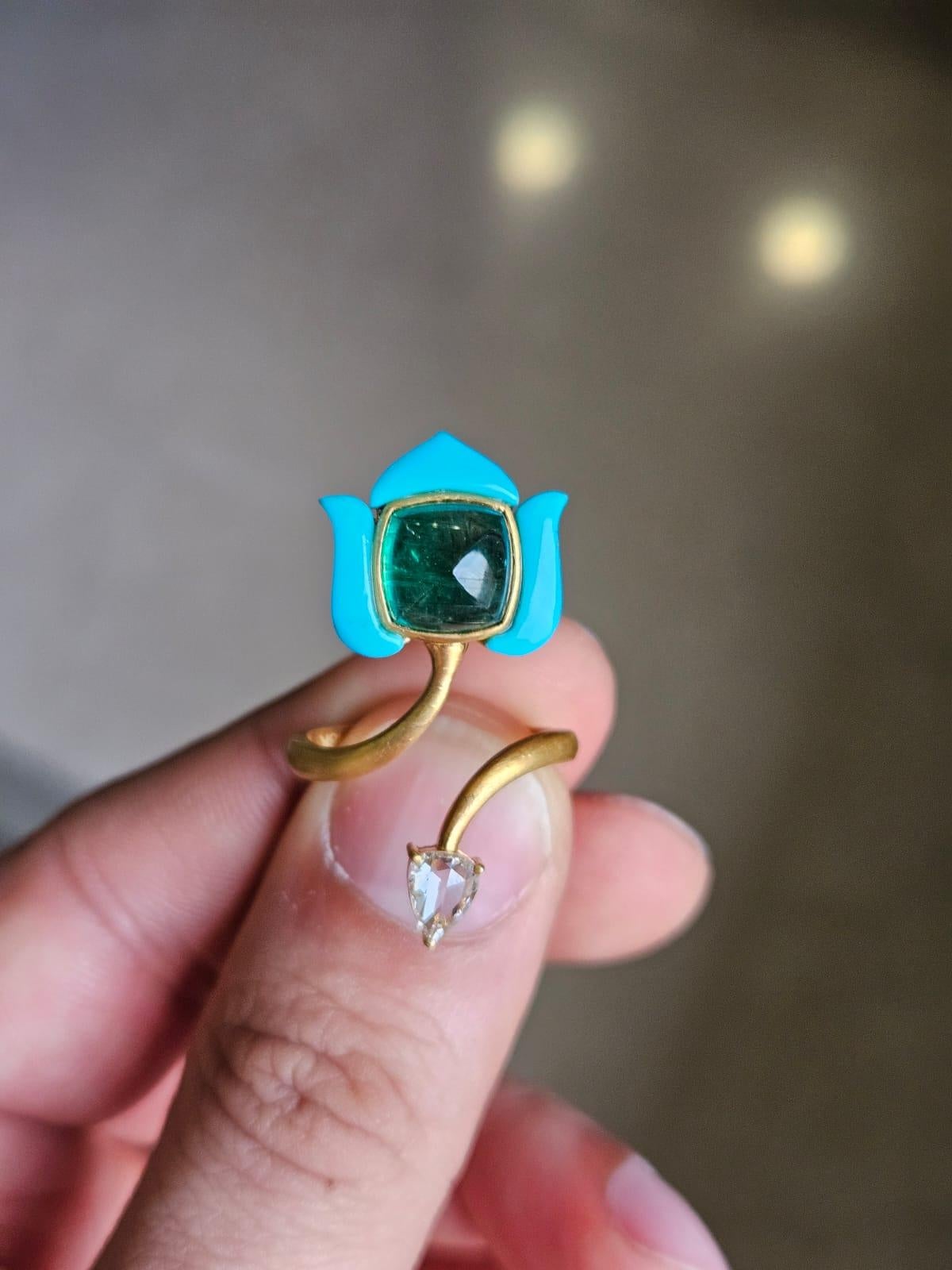 A very gorgeous and Mughal inspired, Emerald & Turquoise Wrap Around Cocktail Ring set in 18K Yellow Matte Gold & Diamonds. The weight of the Emerald sugarloaf is 3.57 carats. The Emerald is completely natural, without any treatments and is of