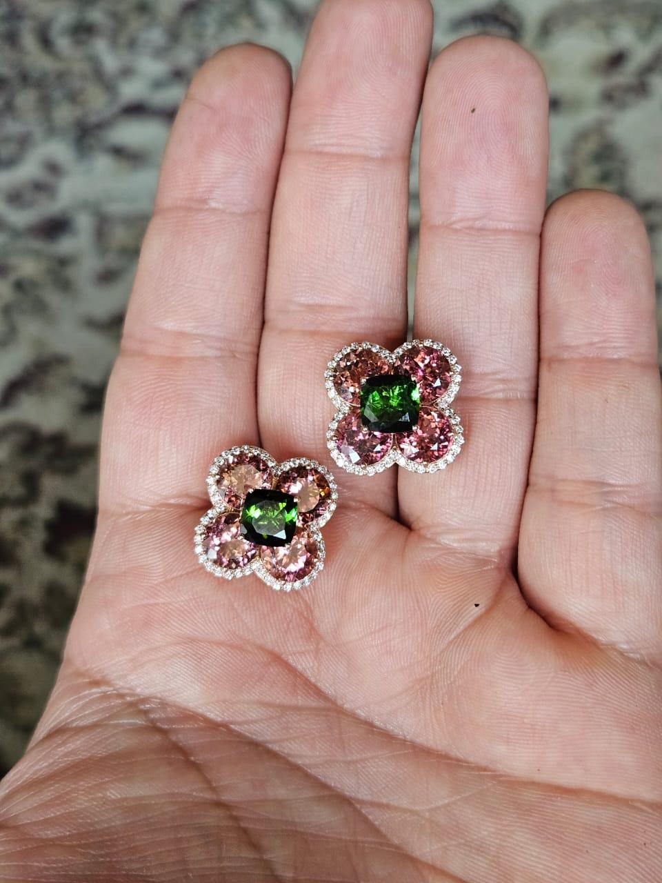 A very gorgeous and beautiful, modern style, Tourmaline Stud Earrings set in 18K White Gold & Diamonds. The combined weight of the Pink & Green Tourmaline is 13.73 carats. The Diamonds weight is 0.55 carats. Net 18K Gold weight is 7.23 grams. The