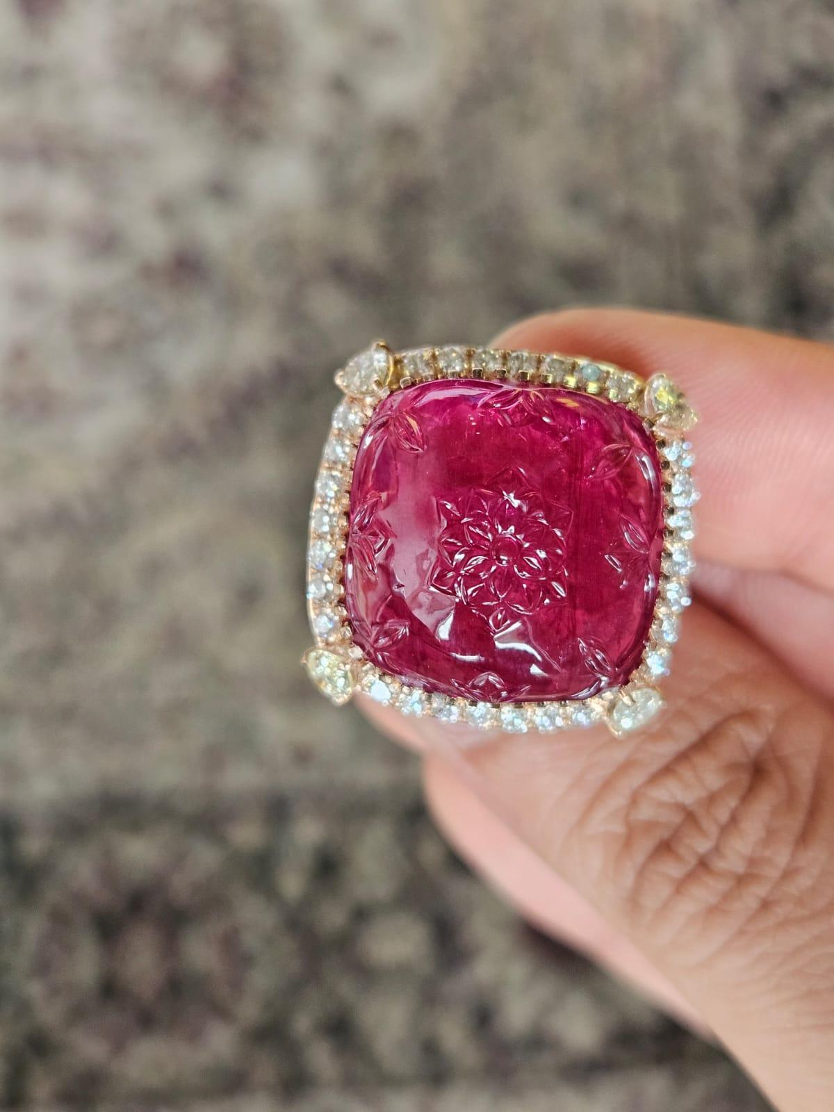 A very gorgeous and beautiful, Rubellite Cocktail Dome Ring set in 18K Rose Gold & natural Diamonds. The weight of the carved Rubellite is 32.33 carats. The Rubellite cabochon is hand-carved in our very own workshop. The combined Diamonds weight is