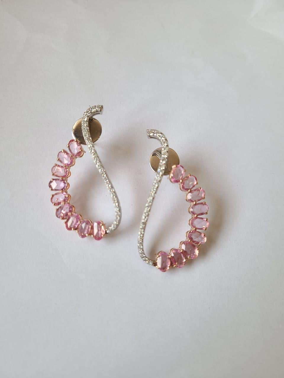 A very gorgeous and one of a kind, Pink Sapphire Chandelier Earrings set in 18K Rose Gold & Diamonds. The weight of the Pink Sapphires is 6.27 carats. The Pink Sapphires are of Madagascar origin. The weight of the Diamonds is 1.02 carats. Net Gold