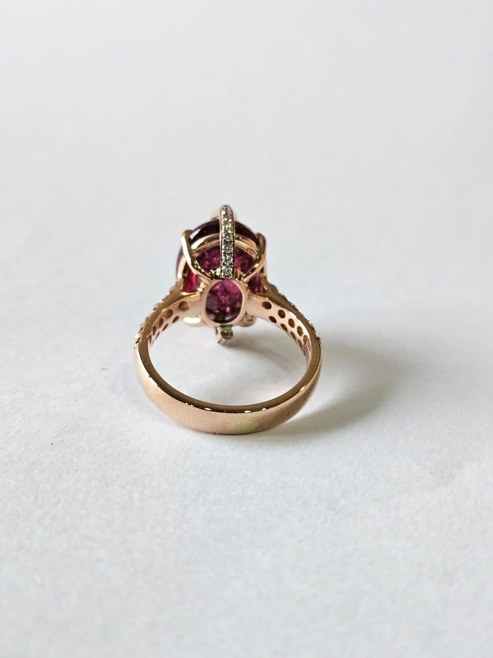 A very gorgeous and special, Tourmaline Dome Cocktail Ring set in 18K Rose Gold & natural Diamonds. The weight of the Tourmaline cabochon is 9.98 carats. The combined Diamonds weight is 1.11 carats. Net 18K Gold weight is 5.63 grams. The Gross