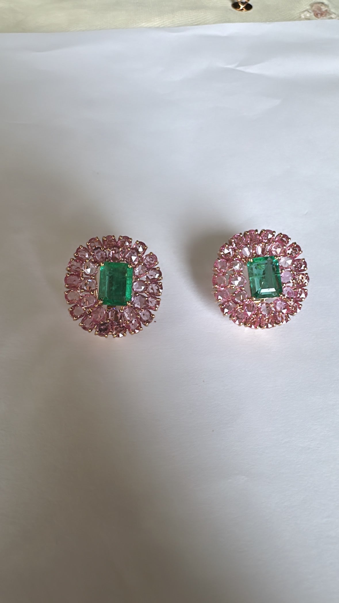 A very gorgeous and modern style, Emerald & Pink Sapphire stud Earrings set in 18K Rose Gold. The weight of the Emeralds is 4.27 carats. The Emeralds are completely natural, without any treatment and is of Zambian origin. The weight of the Pink