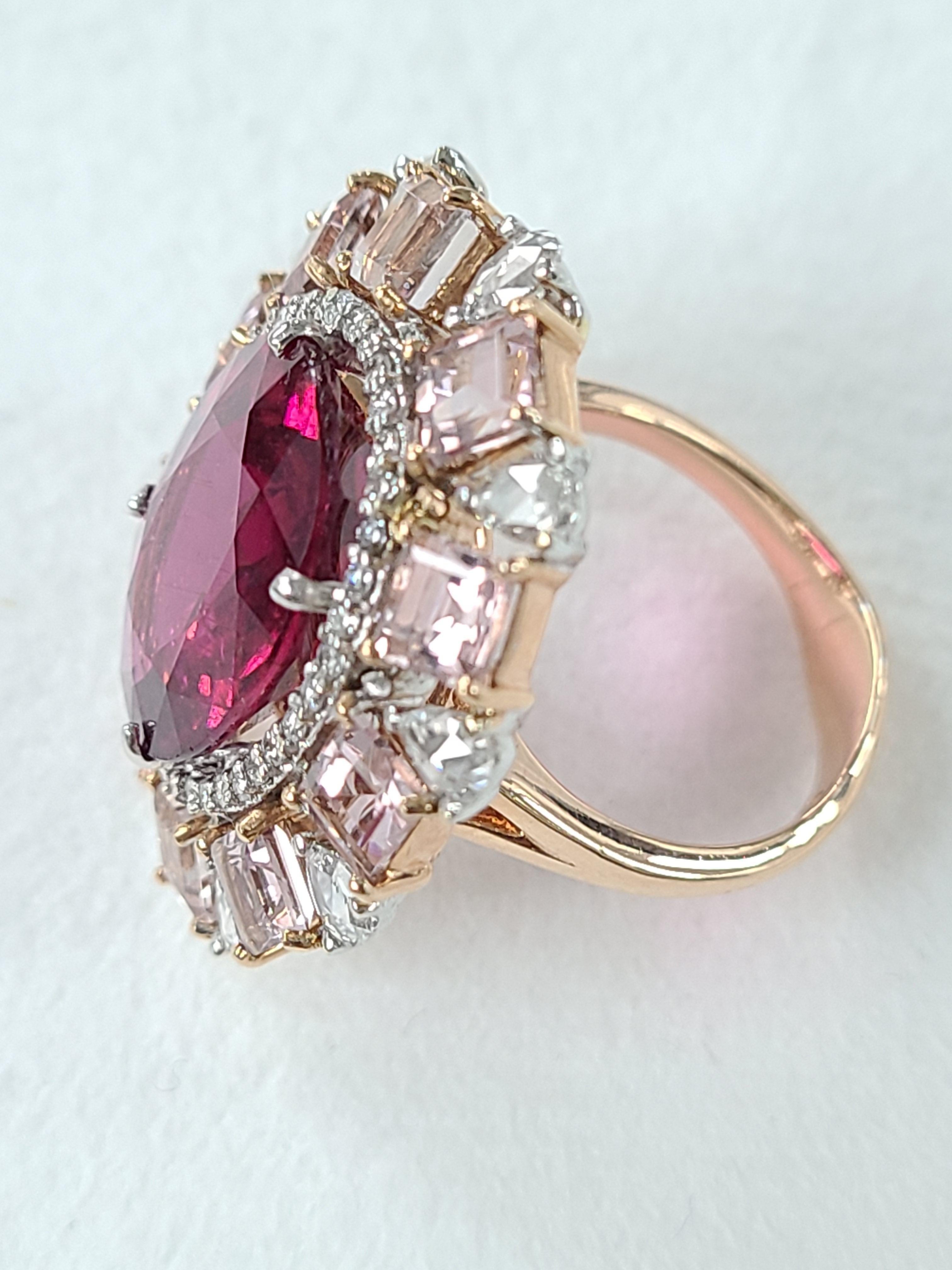 A beautiful rubellite ring surrounded by morganite and diamonds set in 18k rose gold . rubylite weight is 9.29 carats , morganite weight is 3.30 carats and combined diamond weight is 1.17 carats. Ring sixe US 6 1/2 , can be altered on request !
