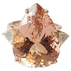 Set in 18K Rose Gold, 19.46 Carats, Pear Shaped Morganite 
Diamonds Cocktail Ring
