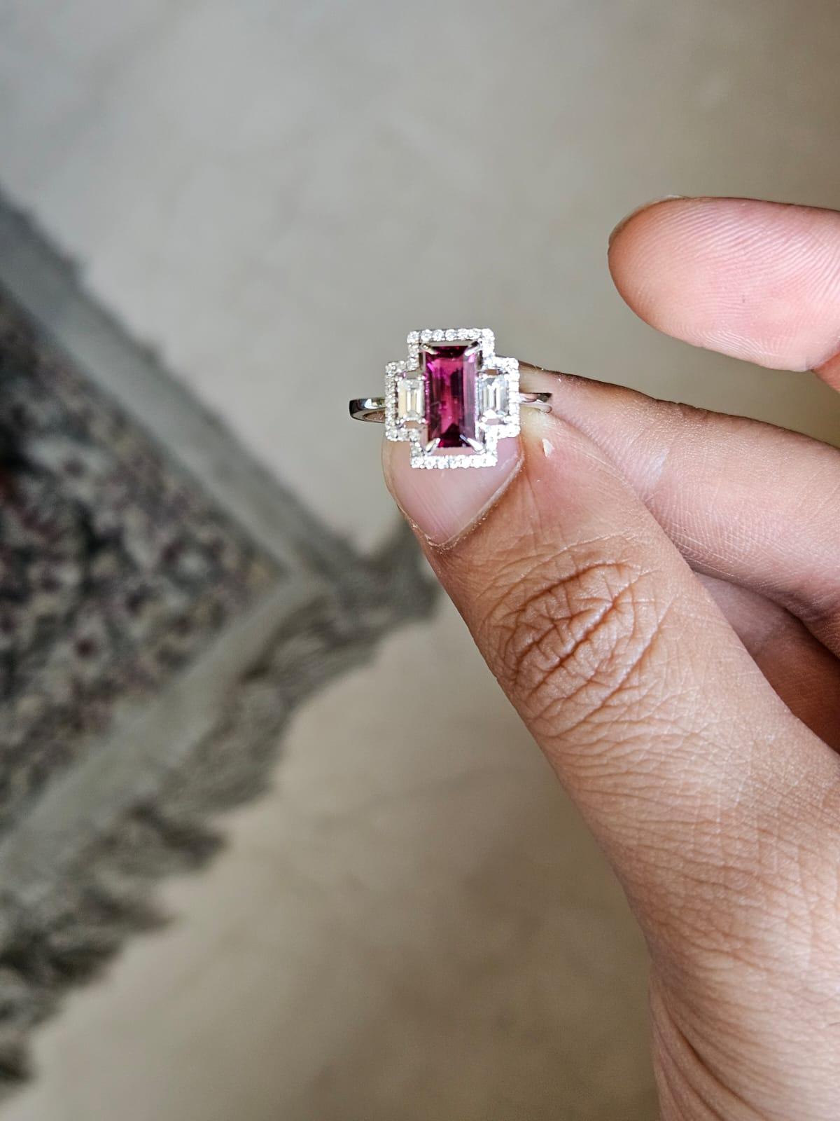 A very gorgeous and beautiful, modern style, Rubellite Engagement Ring set in 18K White Gold & natural Diamonds. The weight of the Rubellite is 1.26 carats. The Diamonds weight is 0.40 carats. Net 18K white Gold weight is 3.28 grams. The gross