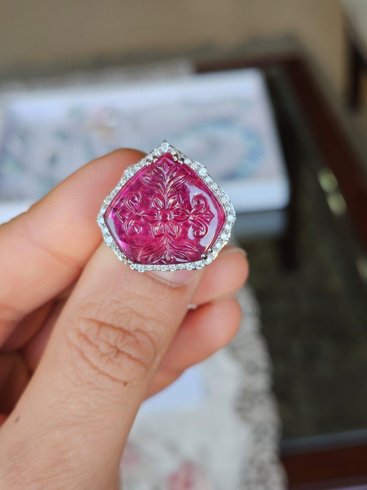 A very gorgeous and beautiful, classical style, Rubellite Cocktail Ring set in 18K White Gold & natural Diamonds. The weight of the carved Rubellite is 13.38 carats. The Rubellite is hand - carved in our very own workshop. The Diamonds weight is