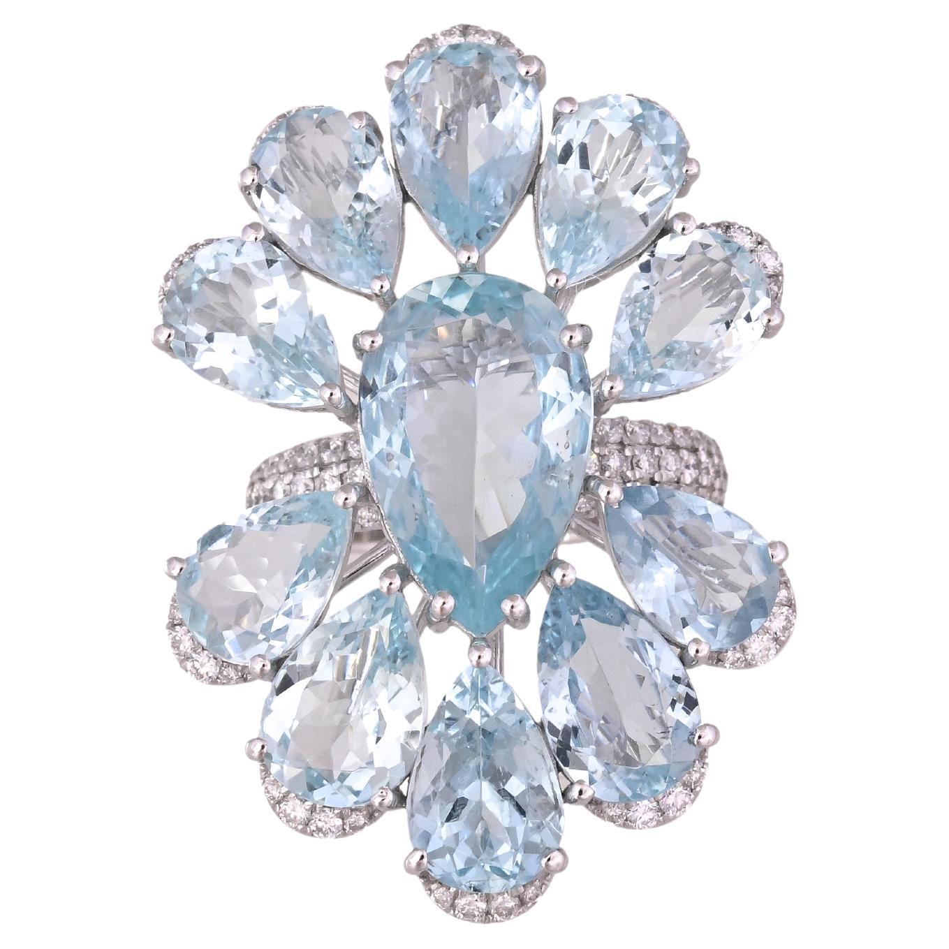 A very gorgeous and beautiful, modern style, Aquamarine over-sized Cocktail Ring set in 18K White Gold & natural Diamonds. The combined weight of the Aquamarine is 16.20 carats. The Diamonds weight is 0.75 carats. Net 18K White Gold weight is 8.21