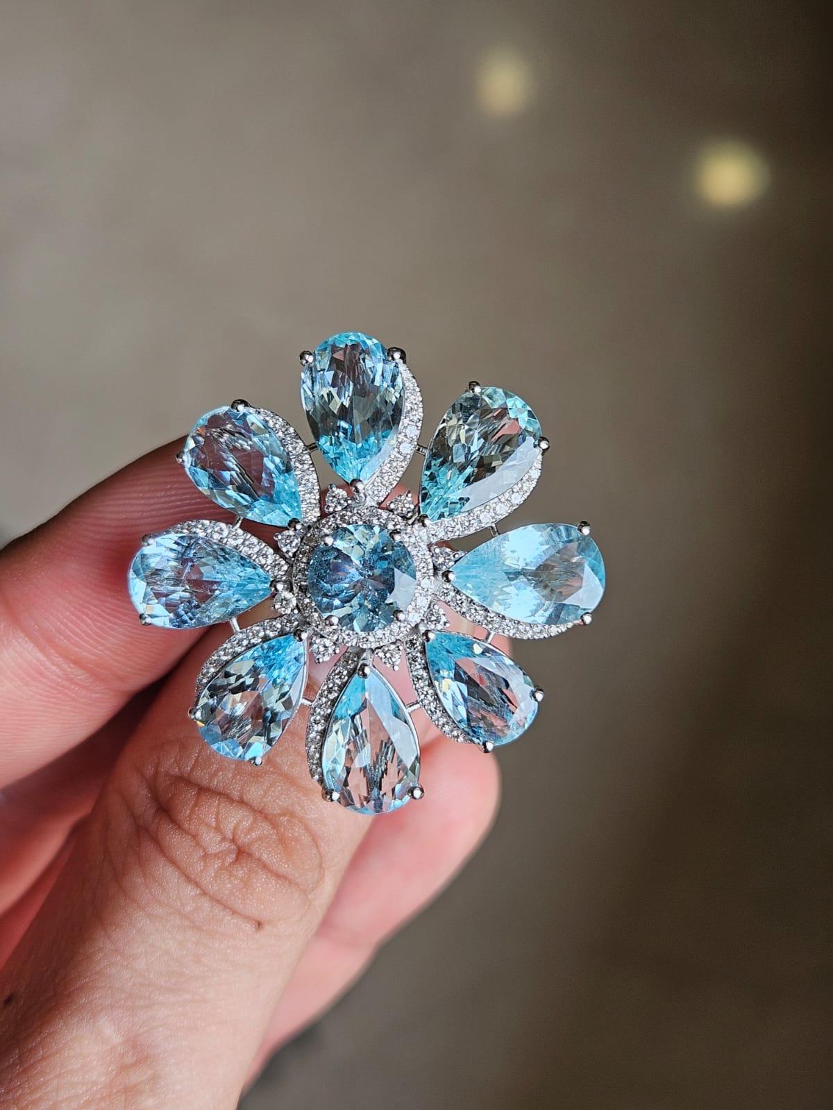 A very gorgeous and beautiful, modern style Aquamarine Cocktail Ring set in 18K White Gold & natural Diamonds. The weight of the Aquamarines is 18.94 carats. The Diamonds weight is 1.10 carats. Net 18K Gold weight is 9.09 grams. The gross weight of