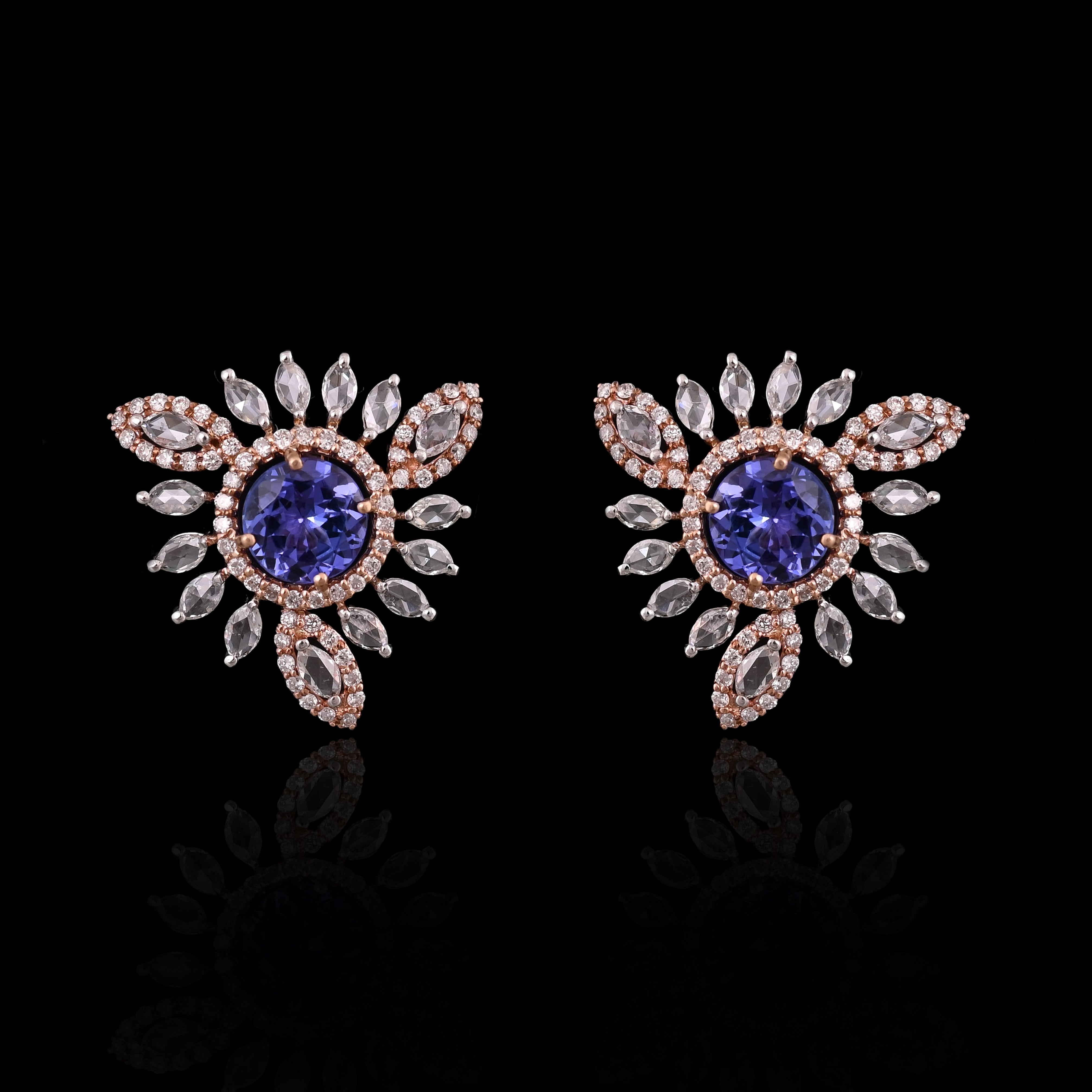 A very gorgeous and beautiful, modern styles Tanzanite Stud Earrings set in 18K White & Rose Gold & Diamonds. The weight of the Tanzanite rounds is 2.24 carats. The Tanzanites are responsibly sourced from Tanzania. The weight of the Rose Cut