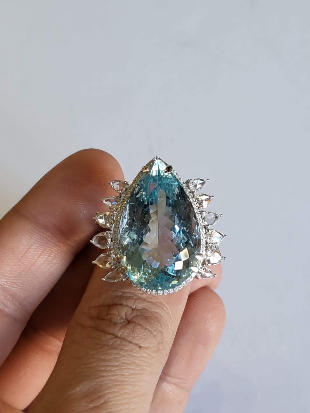 A very beautiful and one of a kind, Aquamarine Cocktail Ring set in 18K White Gold. The weight of the Aquamarine is 26.69 carats. The combined weight of the Diamonds 1.45 carats. Net Gold weight is 8.46 grams. The dimensions of the ring are 2.80cm x