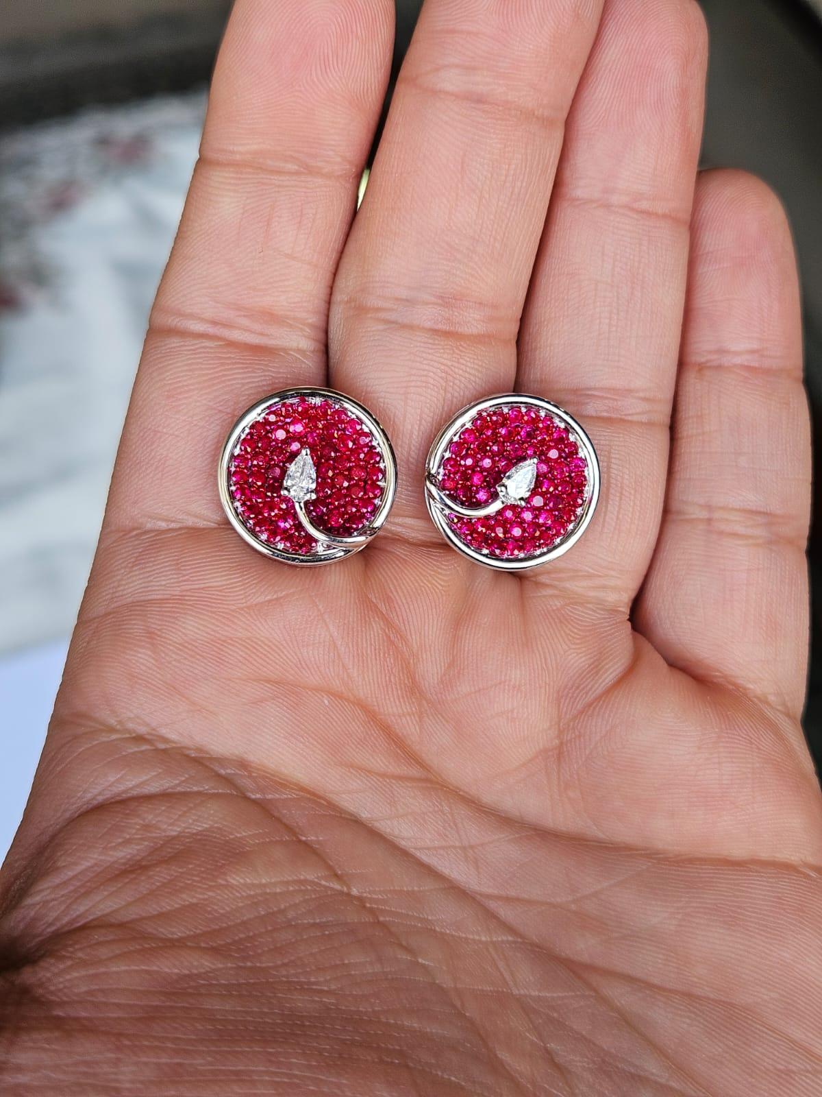 A very gorgeous and beautiful, modern style, Ruby Stud Earrings set in 18K White Gold & natural Diamonds. The weight of the Ruby is 2.67 carats. The Diamonds weight is 0.64 carats. Net 18K Gold weight is 7.61 grams. The Gross weight of the Earrings