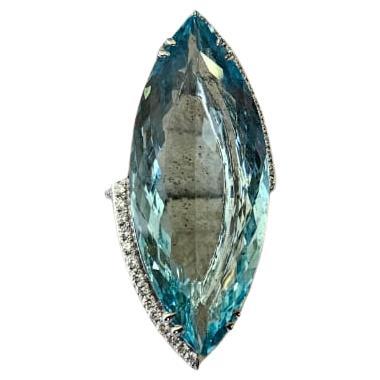 A very gorgeous and beautiful, modern style, Aquamarine Cocktail Ring set in 18K White Gold & natural Diamonds. The weight of the marquise shaped Aquamarine is 29.29 carats. The Diamonds weight is 0.66 carats. Net 18K White Gold weight is 6.45