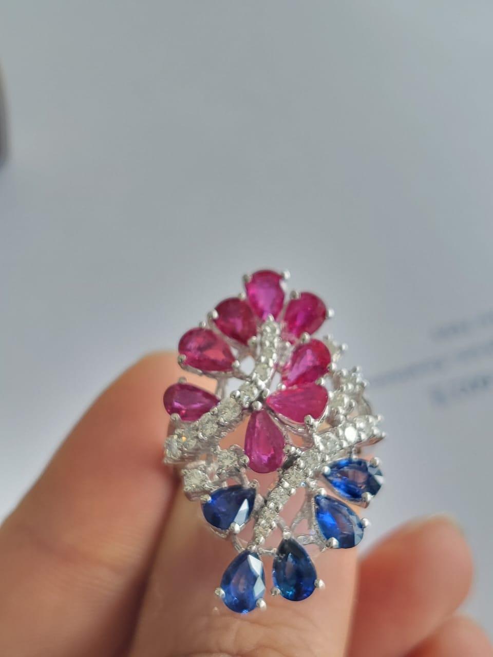 A very gorgeous and beautiful, Ruby & Blue Sapphire Cocktail Ring set in 18K White Gold & Diamonds. The weight of the Ruby is 3.42 carats. The Rubies are of Mozambique origin. The weight of the Blue Sapphires is 3.42 carats. The Blue Sapphires are
