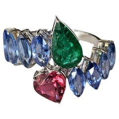Set in 18K White Gold, 3.44 carats Blue Sapphire, Emerald & Tourmaline Band Ring