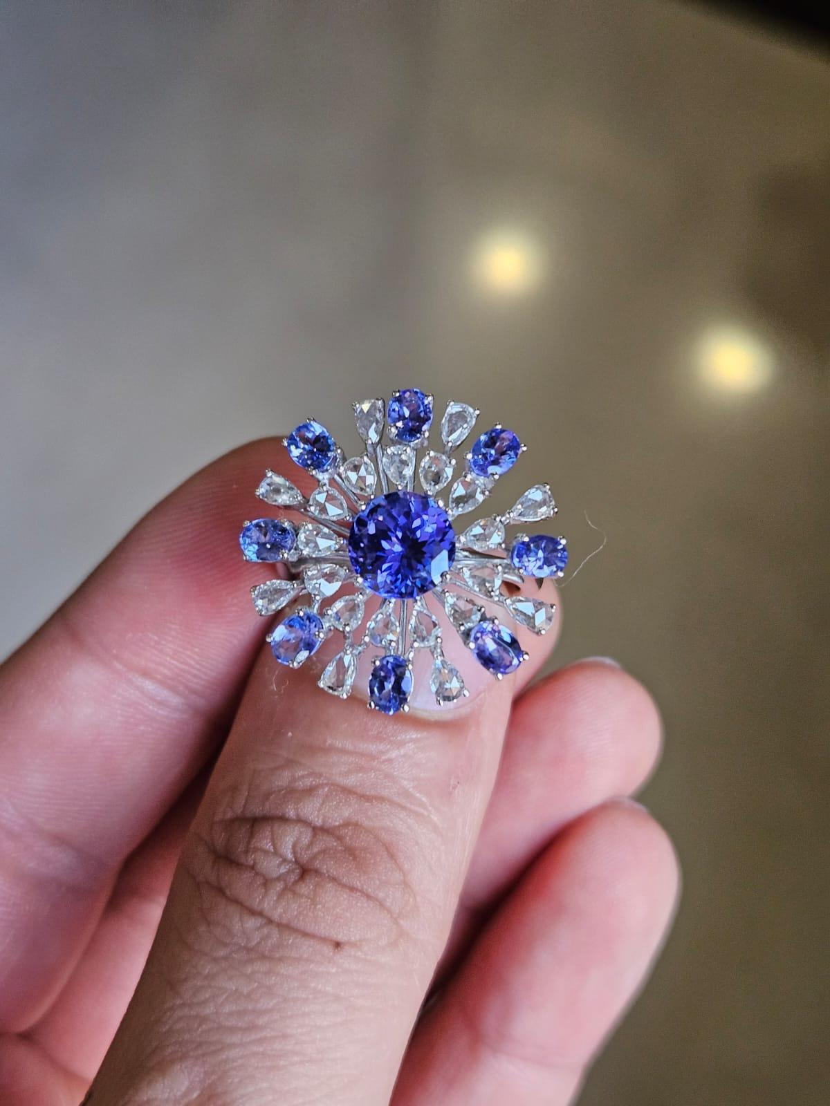 A very gorgeous and beautiful, Tanzanite Cocktail Ring set in 18K White Gold & natural Diamonds. The combined weight of the Tanzanites is 3.56 carats. The Tanzanites are responsibly sourced from Tanzania. The combined Diamonds weight is 1.03 carats.