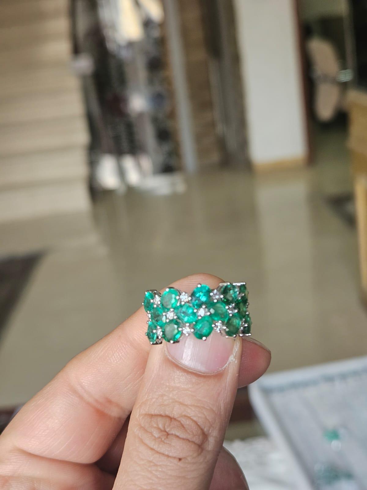 A very gorgeous and beautiful, modern style, Emerald Band Ring set in 18K White Gold & natural Diamonds. The weight of the Emeralds is 4.32 carats. The Emeralds are completely natural, without any treatment and are of Zambian origin. The Diamonds