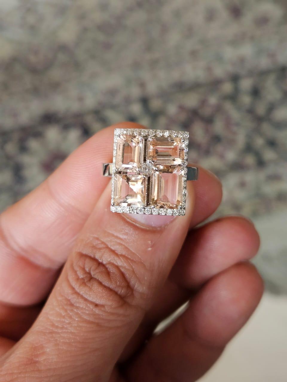 A very gorgeous and beautiful, Morganite & Diamonds Engagement Ring set in 18K White Gold & natural Diamonds. The weight of the Morganites is 4.61 carats. The combined Diamonds weight is 0.36 carats. Net 18K Gold weight is 5.42 grams. The Gross