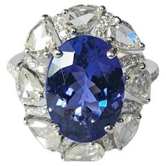 Anillo de compromiso en oro blanco de 18 quilates, tanzanita de 5,16 quilates y diamantes talla rosa