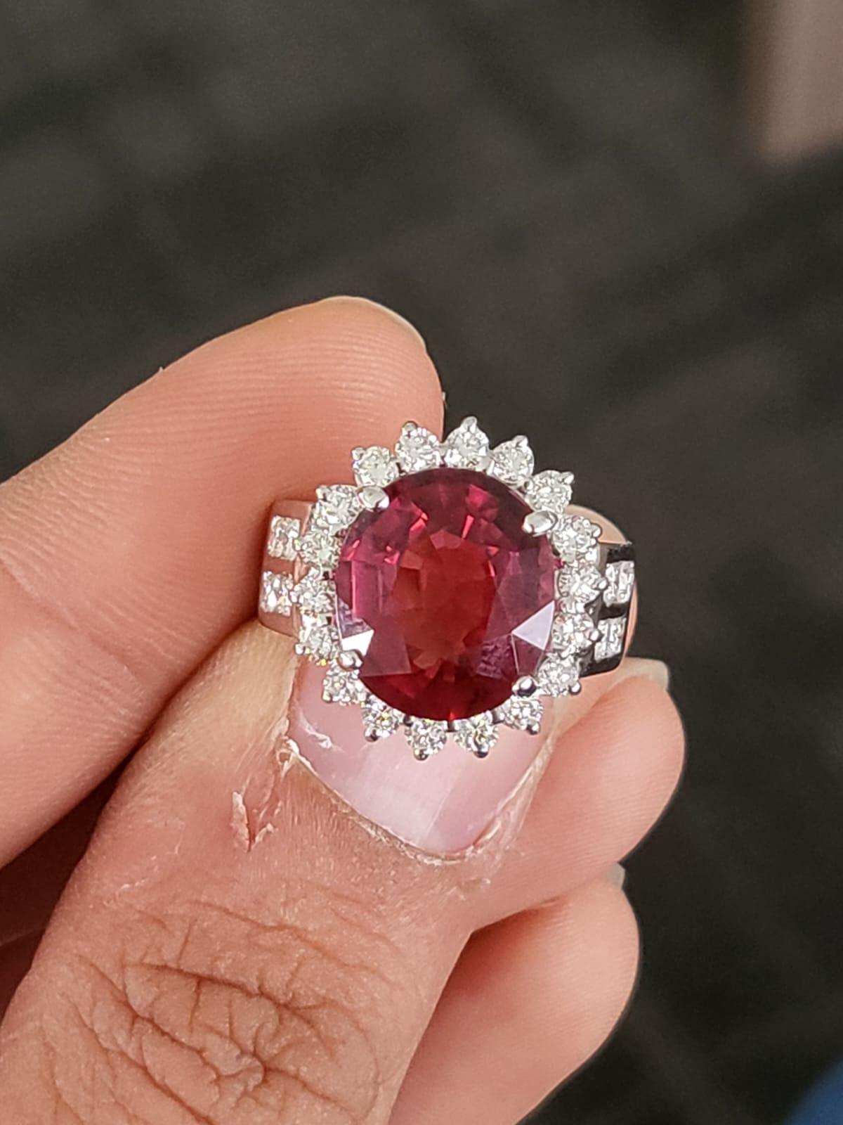 A very gorgeous and one of a kind, Rubellite Engagement Ring set in 18K White Gold & Diamonds. The weight of the Rubellite is 5.49 carats. The weight of the Diamonds is 0.40 carats. Net gold weight is 6.82 grams. The dimensions of the ring are 1.7cm