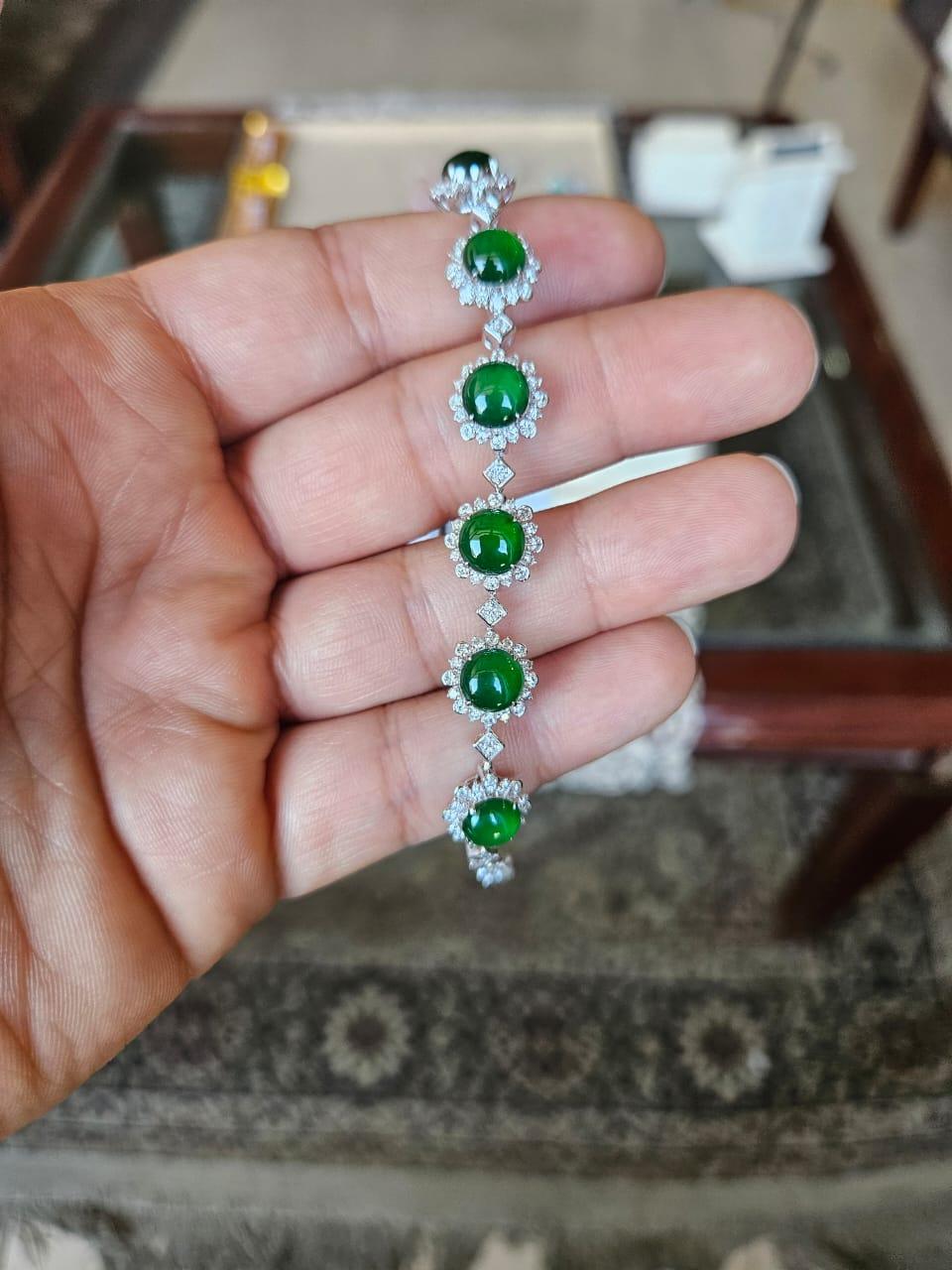 A very gorgeous and beautiful, modern style Jade Bracelet set in 18K White Gold & natural Diamonds. The weight of the Jade cabochons is 7.70 carats. The Diamonds weight is 1.91 carats. Net 18K Gold weight is 12.24 grams. The Gross weight of Bracelet