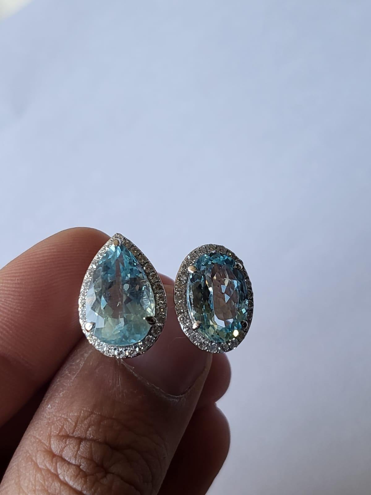 A very gorgeous and one of a kind, Aquamarine Two - Finger / Cocktail Ring set in 18K White Gold & Diamonds. The combined weight of the Aquamarine oval & pear is 7.96 carats. The weight of the Diamonds is 0.61 carats. Net Gold weight is 7.28 grams.