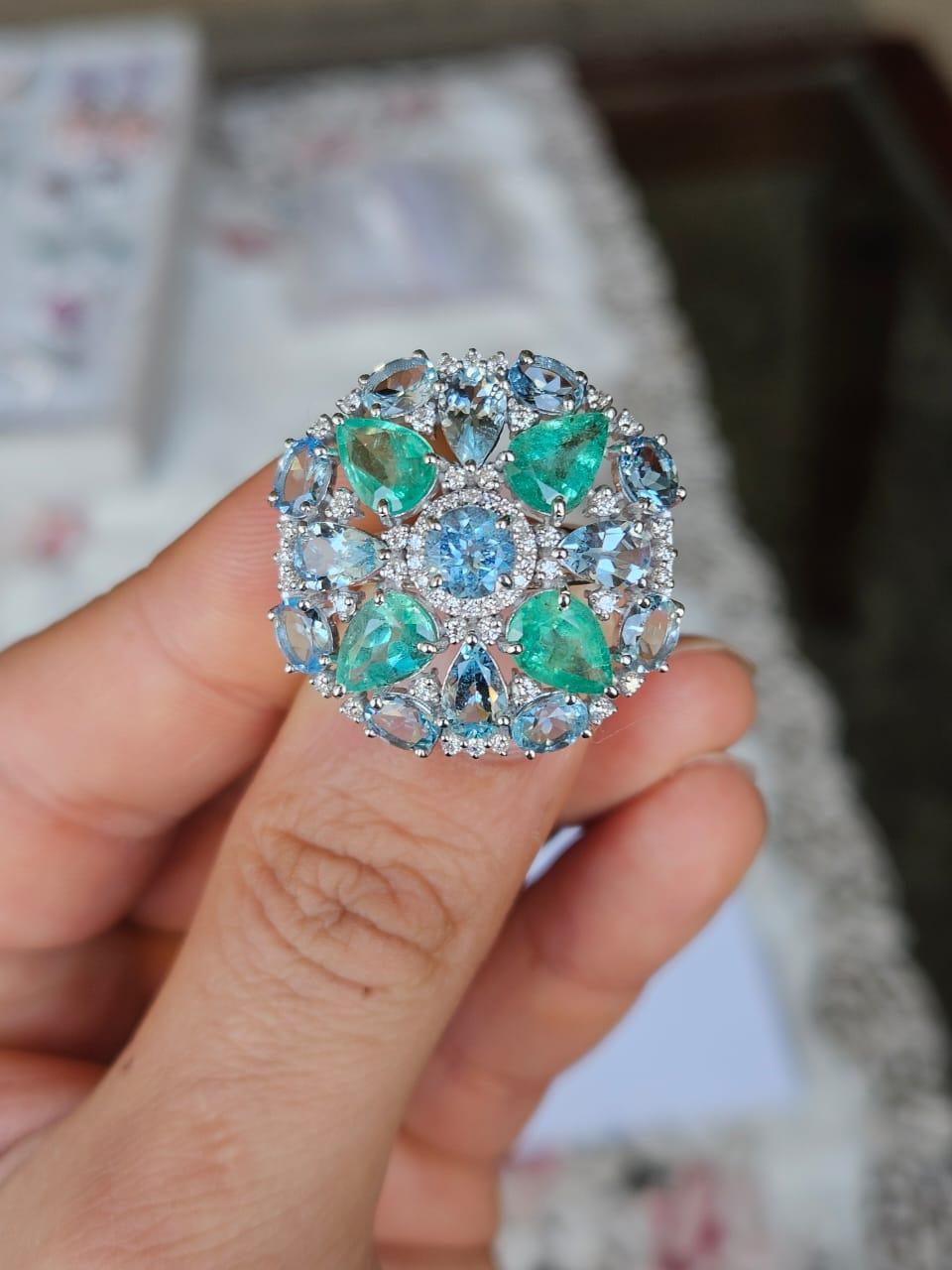 A very gorgeous and beautiful, modern style, Aquamarine & Emerald Cocktail Ring set in 18K White Gold & natural Diamonds. The weight of the Aquamarines is 4.35 carats. The weight of the Emeralds is 3.03 carats. The Emeralds are completely natural,