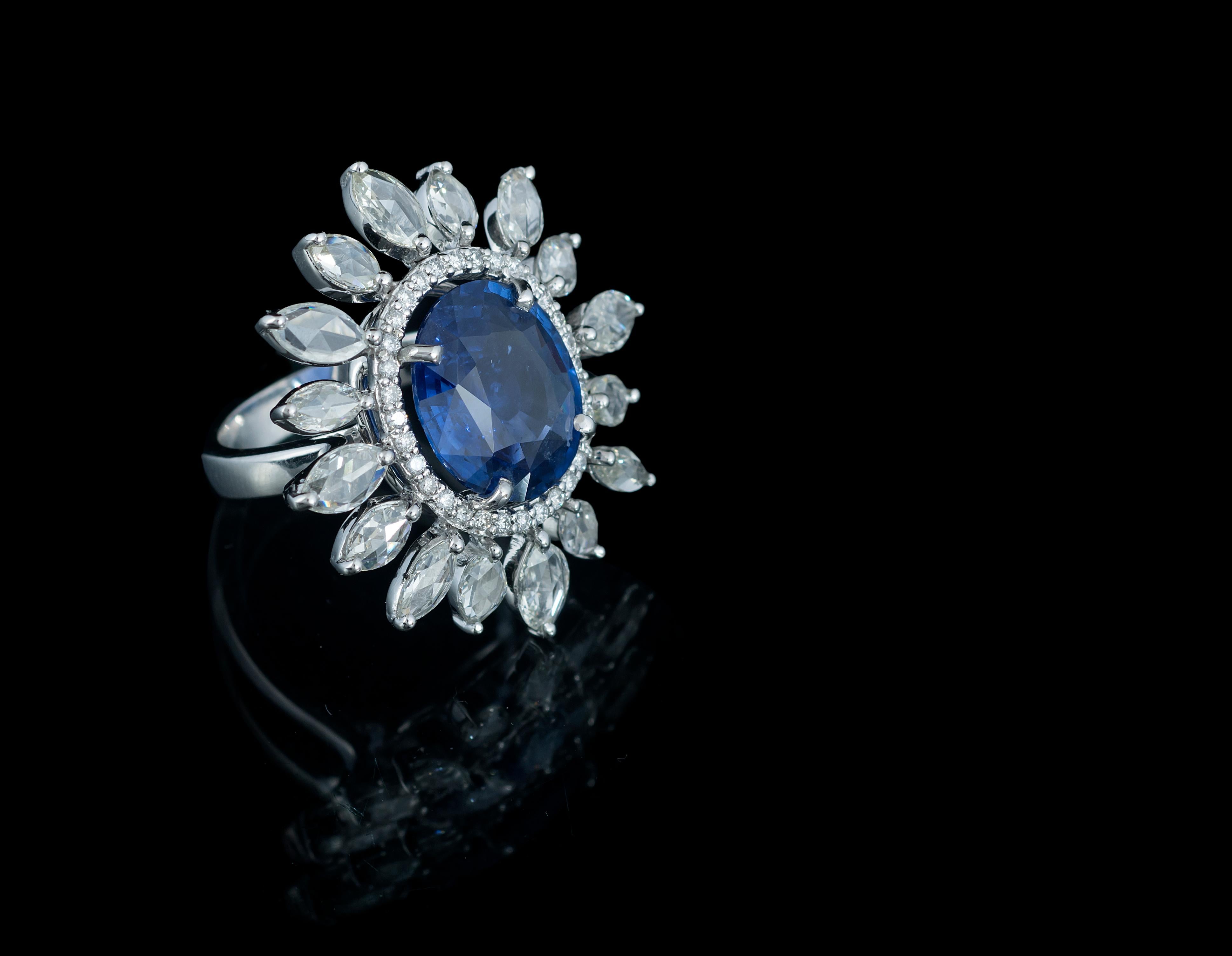 Gorgeous, blue sapphire and rose cut diamond cocktail ring set in 18K white gold, The weight of the sapphire is 6.37 carats, and originates from Sri Lanka. The total weight of rose cut diamonds 2.21 carats. The ring is made in Indian ring size 12