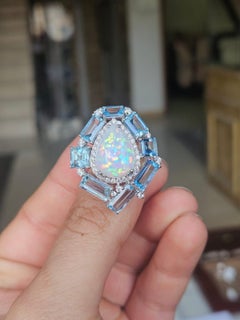 Set in 18K white Gold, Ethiopian Opal, Aquamarines & Diamonds Cocktail Dome Ring