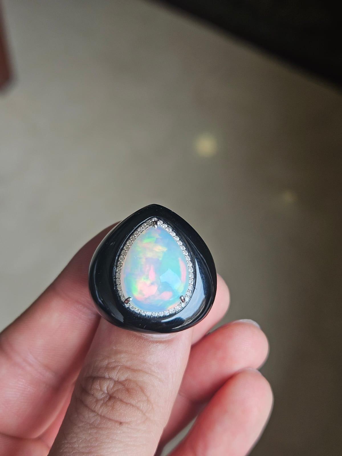 A very gorgeous and beautiful, art - deco style, Ethiopian Opal & Black Onyx Cocktail Dome Ring set in 18K White Gold & natural Diamonds. The weight of the Ethiopian Opal is 6.88 carats. The weight of the Black Onyx is 48.42 carats. The Diamonds