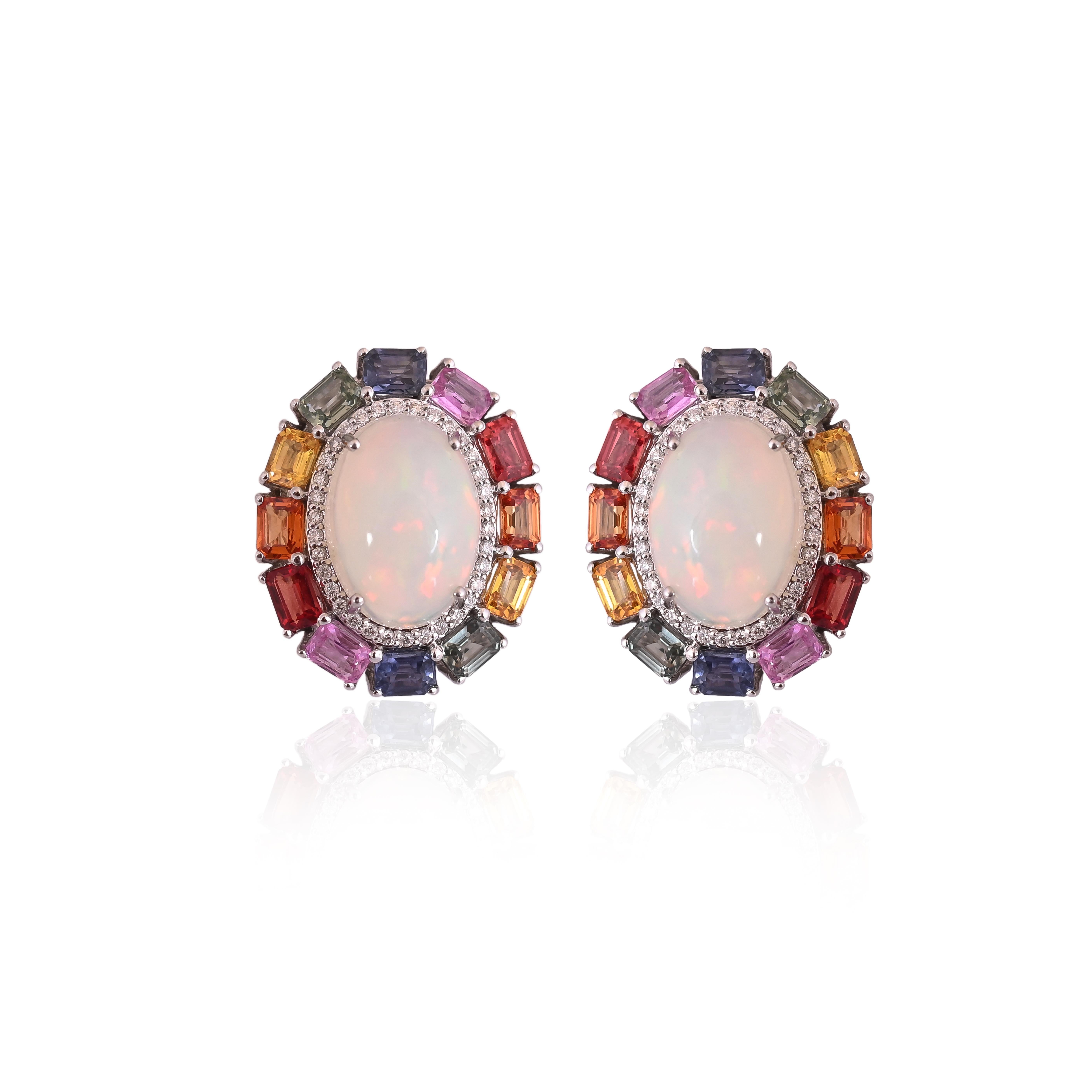 A very gorgeous and stunning, modern style, Opal & Multi Sapphires Stud Earrings set in 18K White Gold & Diamonds. The weight of the Opals is 7.90 carats. The Opals are of Ethiopian origin and have an Orange - Green play of colour. The Multi