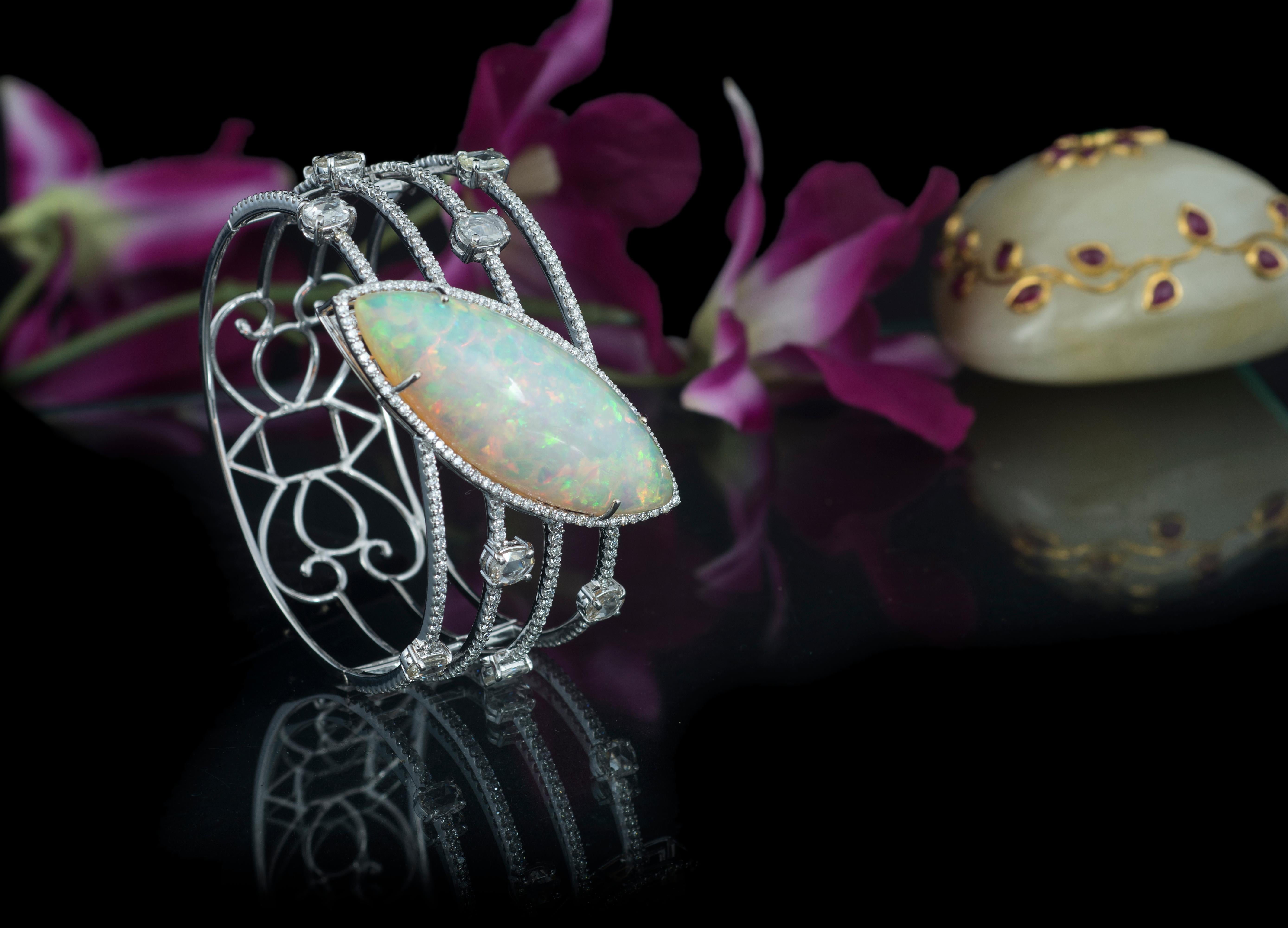 A gorgeous and very chic Ethiopian Opal and Rose Cut Diamonds art - deco style Cuff bracelet. The Ethiopian Opal is natural and weighs 33.37 carats. The weight of the rose cut diamonds is 3.36 carats. The bracelet is a cuff, hence fixed size. The