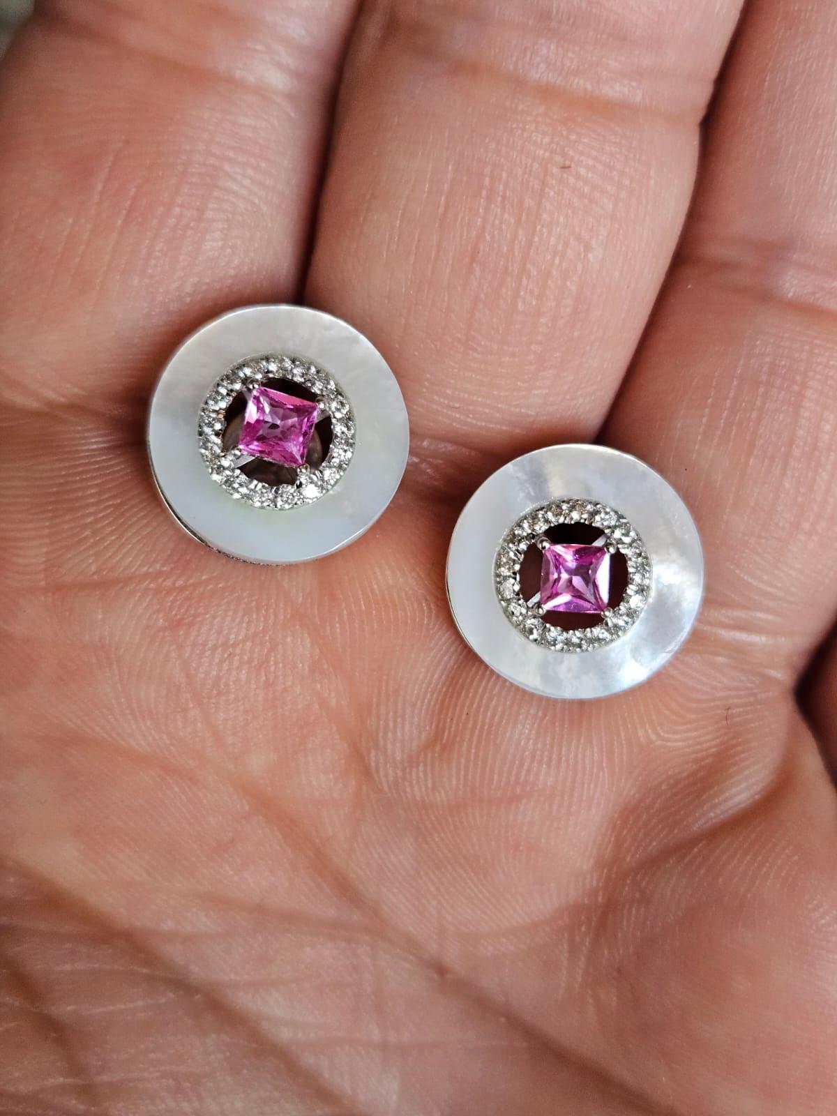 A very gorgeous and beautiful, Mother of Pearl & Pink Sapphire Stud Earrings set in 18K White Gold & Diamonds. The weight of the Pink Sapphires is 0.44 carats. The Pink Sapphires are of Ceylon (Sri Lanka) origin. The weight of Mother of Pearl is