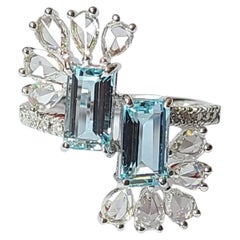 Bague cocktail en or blanc 18 carats sertie d
aigue-marine naturelle et de diamants taille rose