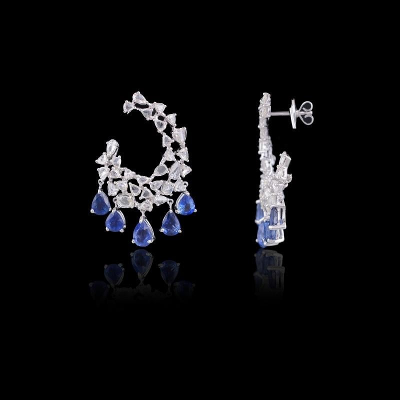 Marvellous natural Blue Sapphire and diamond rose cut earrings set in 18K white gold. The blue sapphire is from Sri Lanka ad weighs 8.73 carats. The total weight of diamond rose cuts is 6.32 carats. The earrings have a simple pull - push mechanism.