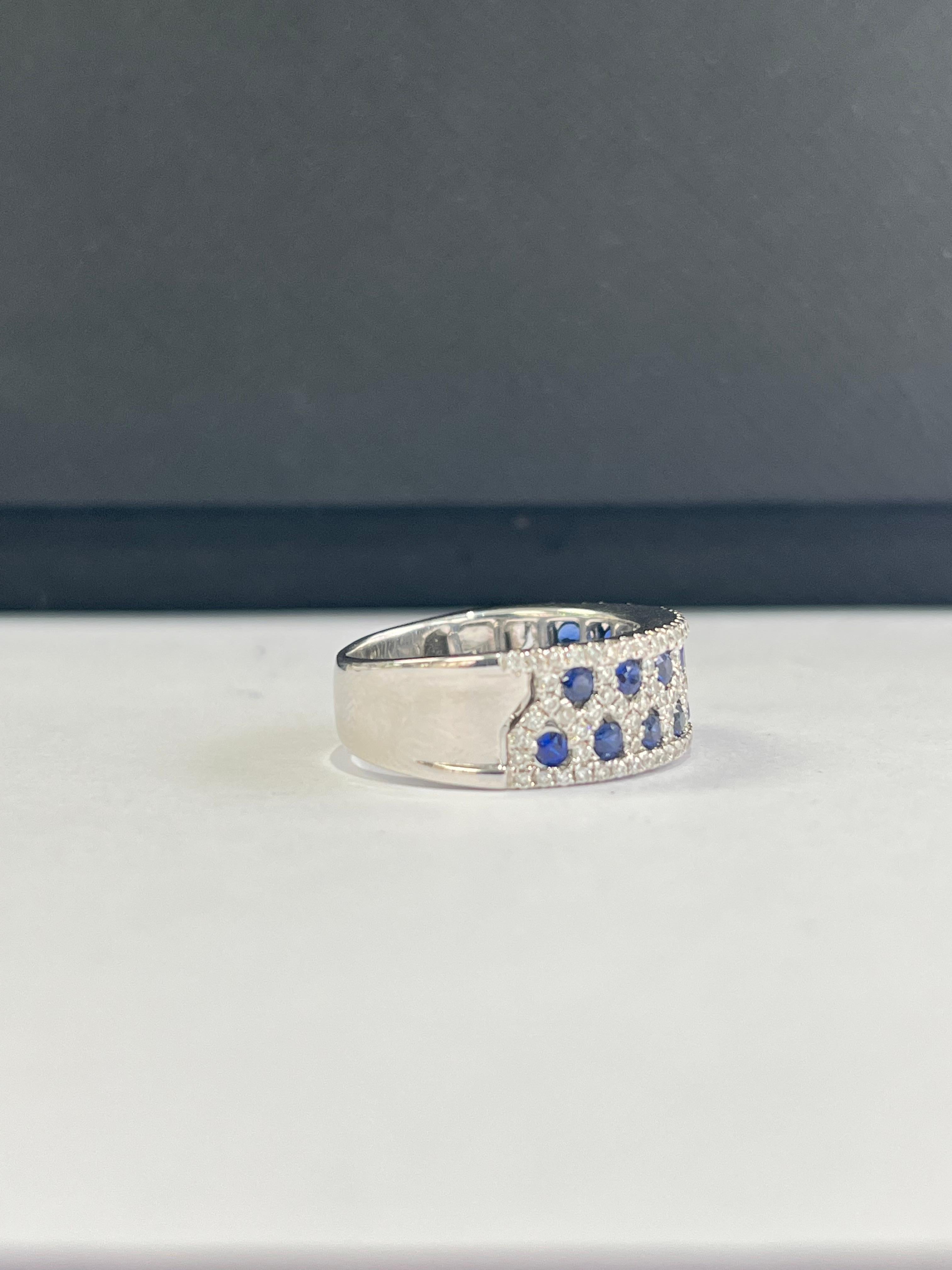 A very gorgeous and one of a kind, Blue Sapphire Band Ring set in 18K White Gold & Diamonds. The weight of the Blue Sapphires is 0.81 carats. The Blue Sapphires are of Ceylon (Sri Lankan) origin. The weight of the Diamonds is 0.70 carats. Net Gold