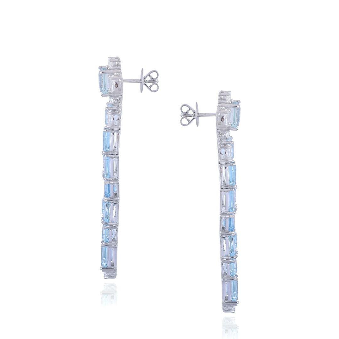A gorgeous pair of natural, cut Aquamarine Chandelier Earrings set in 18K White Gold & Diamonds. The weight of the Aquamarines is 27.47 carats. The Aquamarines are completely natural, without any treatment. The Aquamarines are so excellent quality.