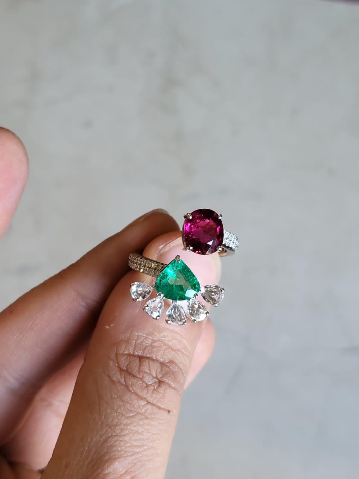 A very gorgeous and of a kind, Emerald & Rubellite Engagement/ Cocktail Ring set in 18K White Gold. The weight of the Emerald is 1.41 carats. The Emerald is completely natural, without any treatment and is of Zambian origin. The weight of the
