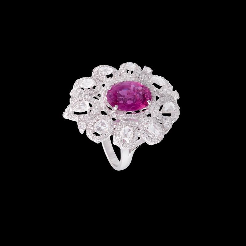 Beautiful, oval shaped pink sapphire ring with rose cut diamonds set in 18K white gold. The weight of the pink sapphire is 4.14 carats and the combined weight of diamond is 2.00 carats. 