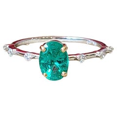 Set in 18K White Gold, Natural Zambian Emerald 
Diamonds Engagement Ring