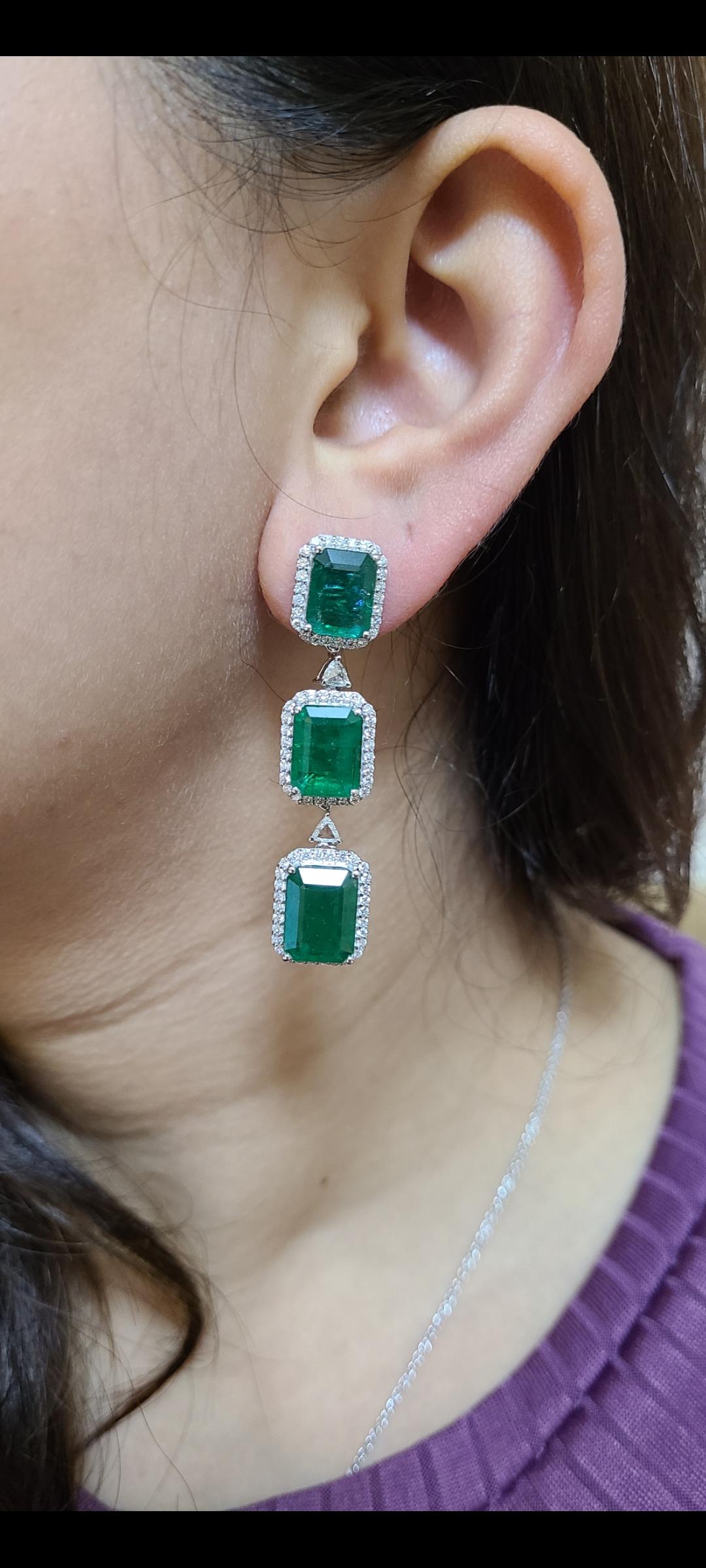 Gorgeous pair of earrings set in 18k gold with natural non treated emeralds and diamonds. emerald weight is about 20.09 carats and diamond weight about 1.54 carats. these earrings are a classic and suitable for all occasions ! earrings dimension in