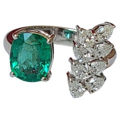 Set in 18K White Gold, oval Zambian Emerald & marquise Diamonds Engagement Ring