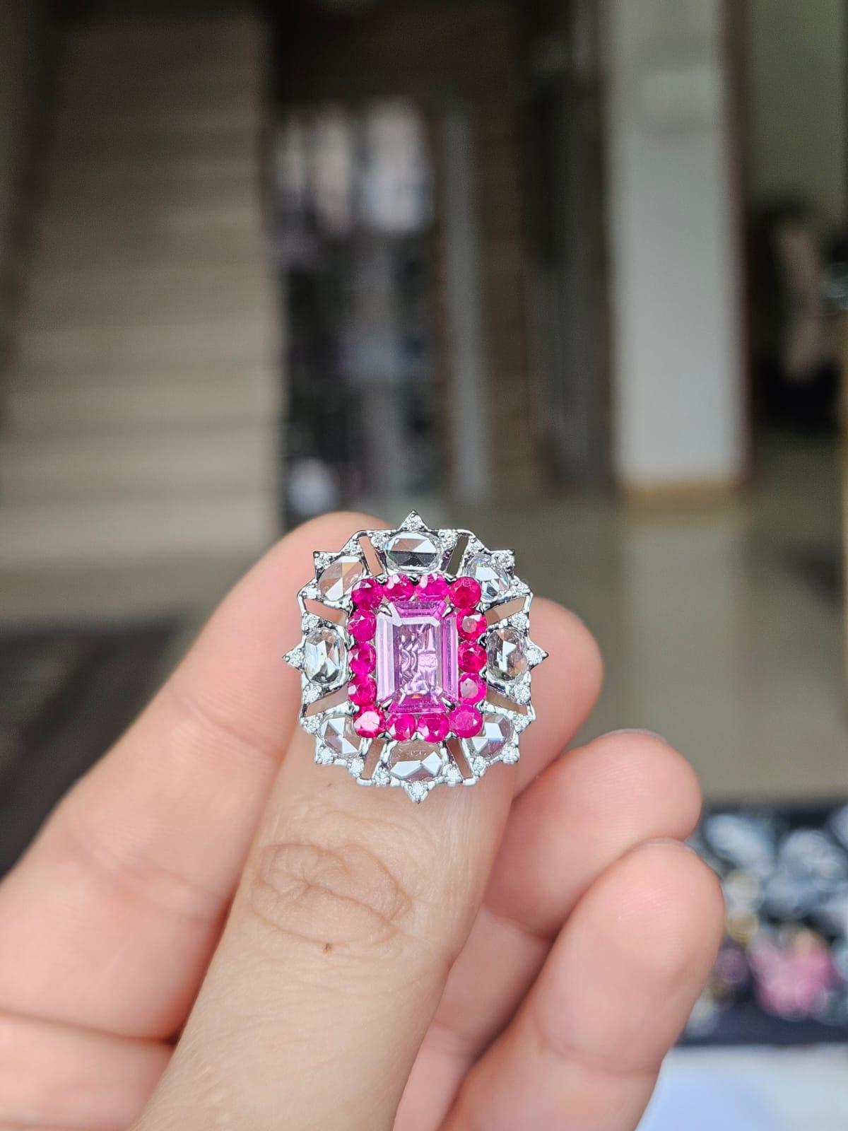 A very gorgeous and beautiful, modern style, Pink Sapphire & Rubies Cocktail Engagement Ring set in 18K White Gold &  natural Diamonds. The weight of the Pink Sapphire is 1.61 carats. The Pink Sapphires are of Ceylon (Sri Lankan) origin. The Ruby