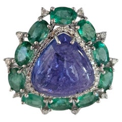 Set in 18K white Gold, Tanzanite Cabochon, Emerald 
Diamonds Cocktail Dome Ring