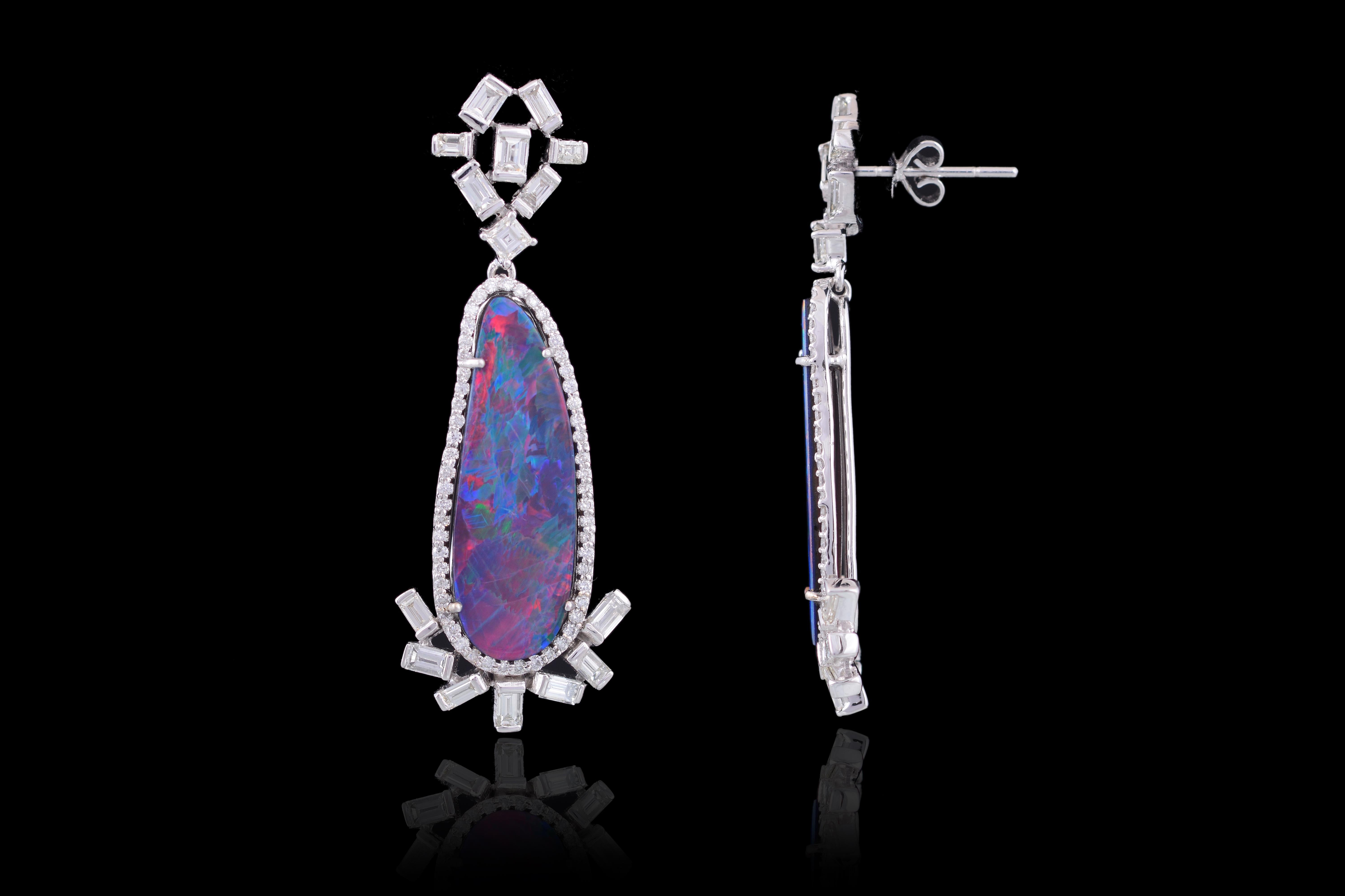 Gorgeous dangler earrings, Set in 18K white gold, Australian doublet and baguette diamonds with a simple push-pull mechanism. Doublet Opal weighing 14.95 carats and baguette diamond weighing 3.21 cts, all set in 18K white gold weighing 11.910 gms.