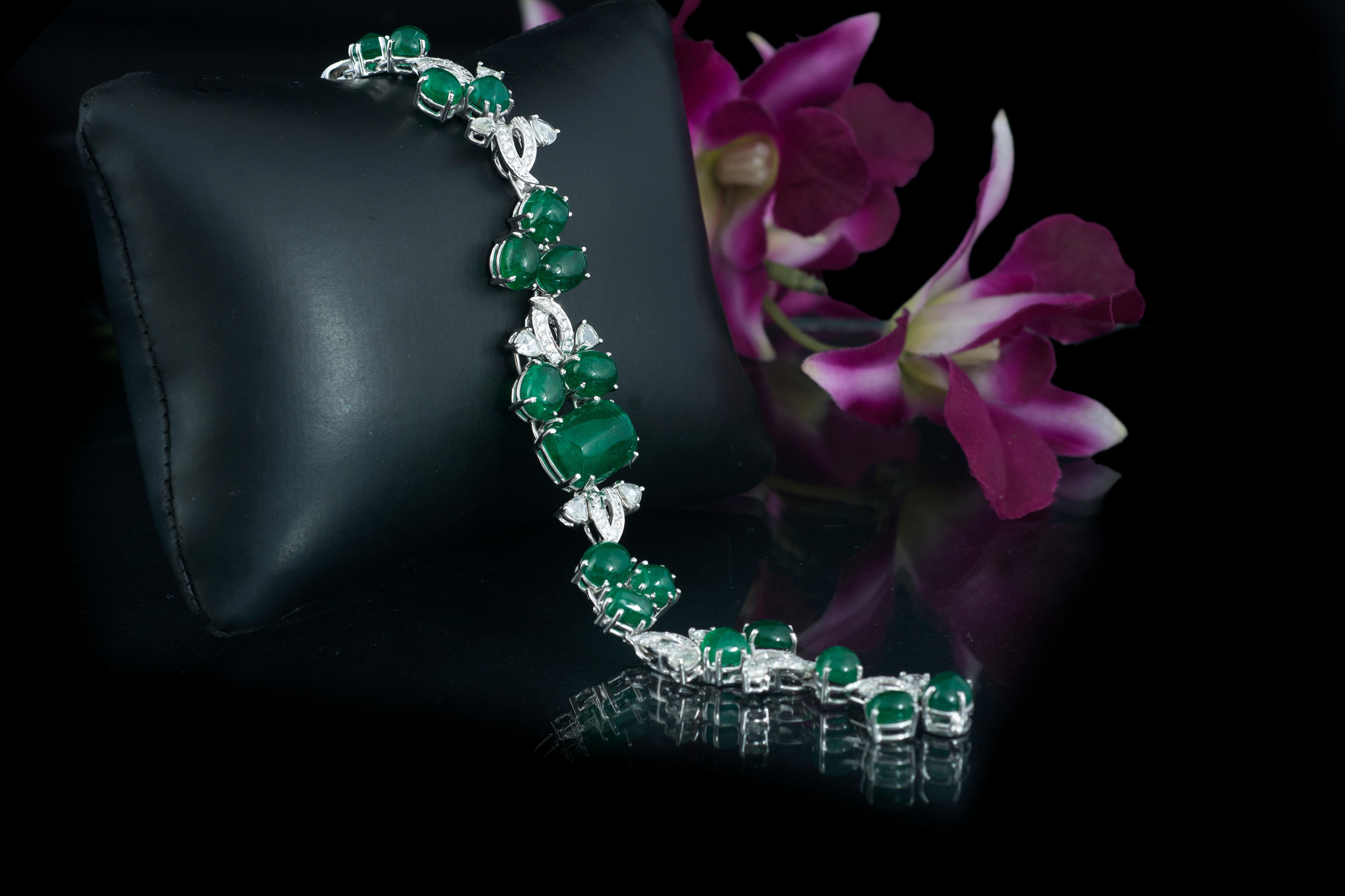 A very gorgeous and wearable emerald and rose cut diamond bracelet set in 18K gold. The Emeralds are natural from Zambia and are free of any treatment. The weight of the emeralds is 32.48 carats. The weight of the diamond rose cuts is 1.49 carats.