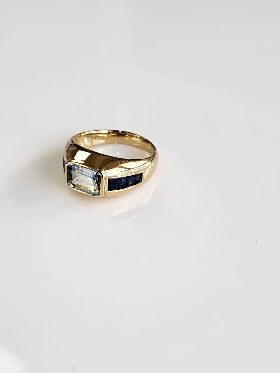 Emerald Cut Set in 18K Yellow Gold, 1.26 carats Aquamarine & Blue Sapphire Engagement Ring For Sale