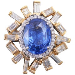 Set in 18K yellow gold, 5.64ct Blue Sapphire and baguette diamonds cocktail ring