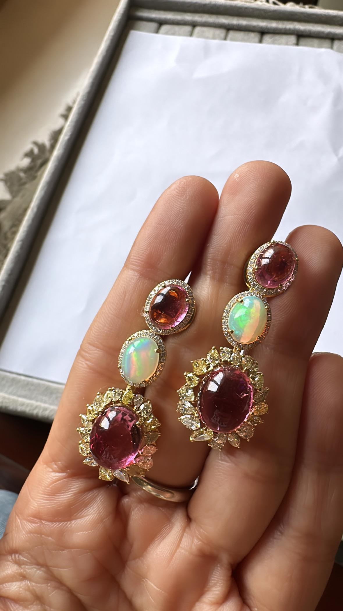 A very gorgeous and artistic style, Tourmaline & Opal Chandelier Earrings set in 18K Yellow Gold & Diamonds. The weight of the Tourmaline Cabochons is 18.58 carats. The weight of the Ethiopian Opals is 2.72 carats. The combined Diamonds weight is