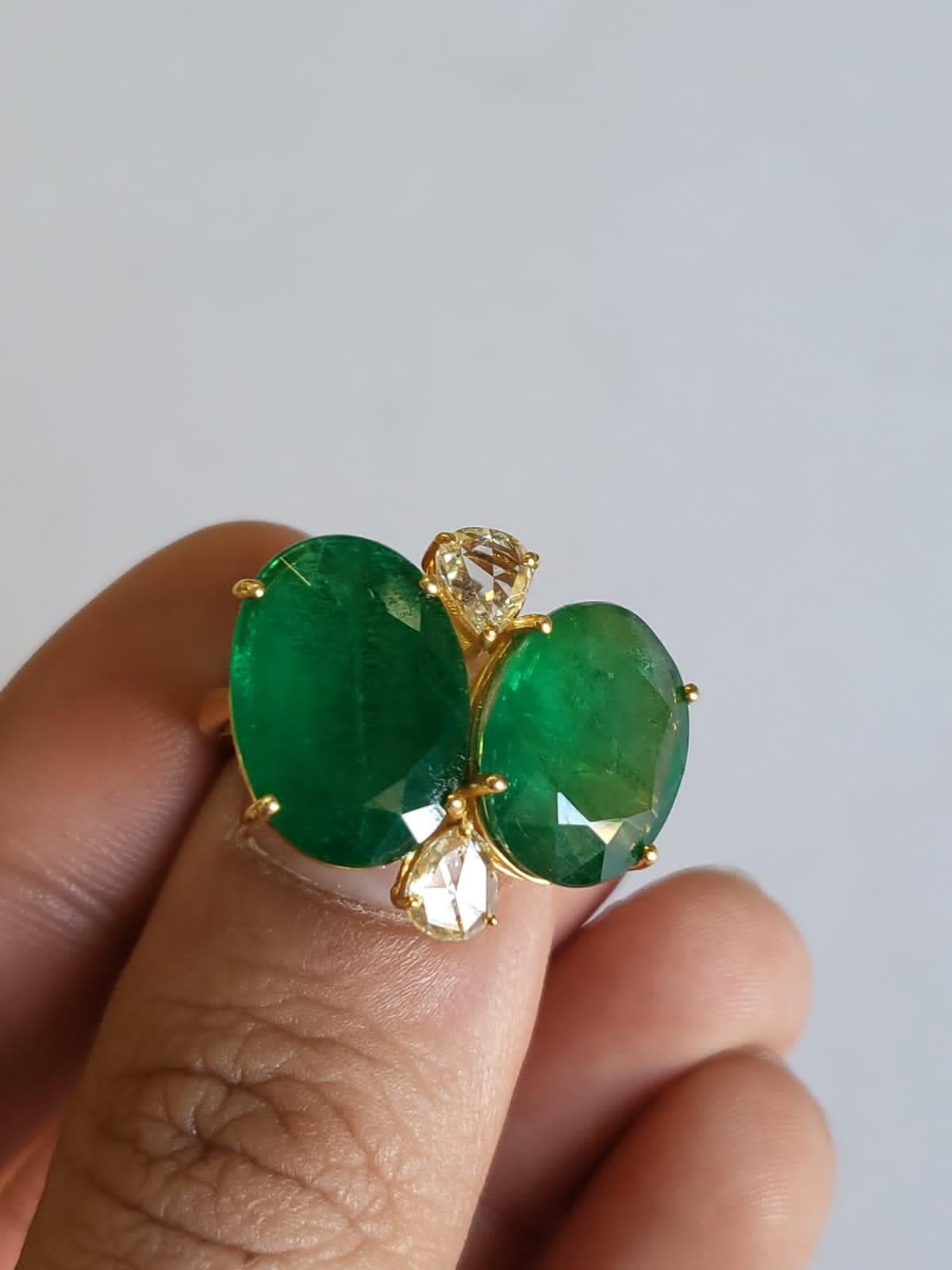 A very gorgeous and one of a kind, Emerald Cocktail Ring set in 18K Matte Yellow Gold & Diamonds. The weight of the Emeralds is 12.04 carats. The Emeralds are completely natural, without any treatment and is of Zambian origin. The weight of the Rose